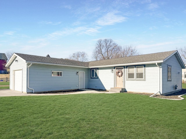 ranch-style house with a front yard and a garage