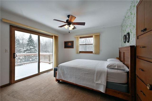 carpeted bedroom with access to outside and ceiling fan