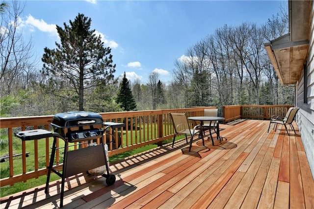 wooden terrace with a yard