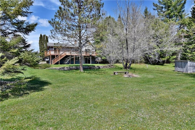 view of yard with a wooden deck