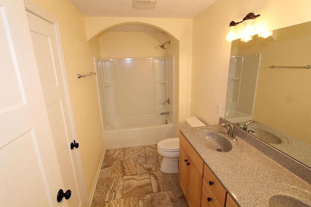 full bathroom with vanity, shower / bath combination, and toilet