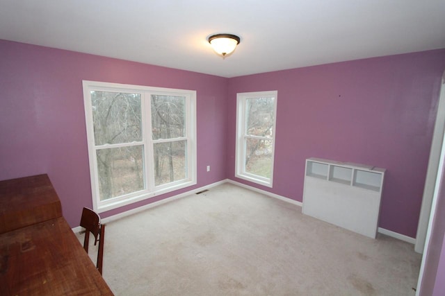 interior space featuring light colored carpet