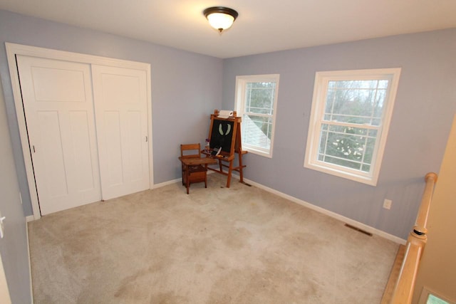 interior space featuring light colored carpet