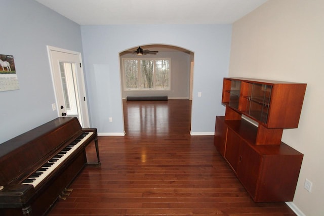 hallway with dark wood-type flooring