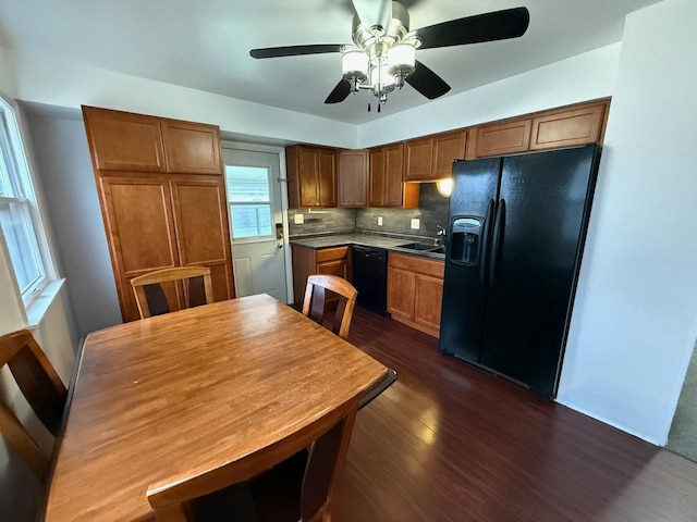 kitchen featuring backsplash, black appliances, sink, dark hardwood / wood-style floors, and ceiling fan