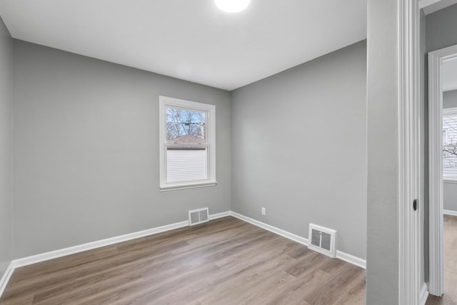 spare room featuring light wood-type flooring