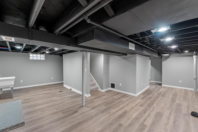 basement with wood-type flooring