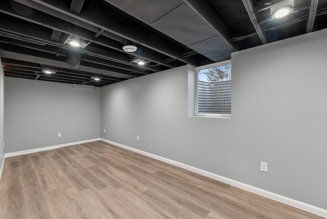 basement featuring hardwood / wood-style flooring