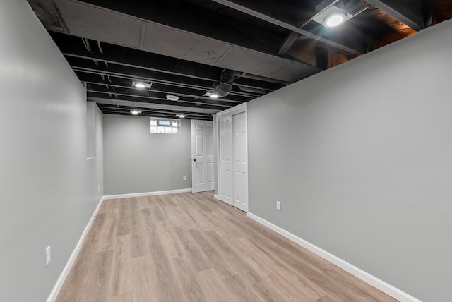 basement featuring light hardwood / wood-style floors