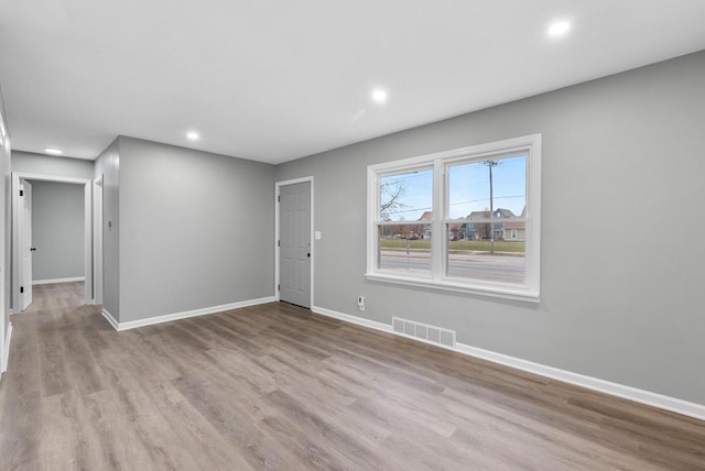 unfurnished room featuring light wood-type flooring