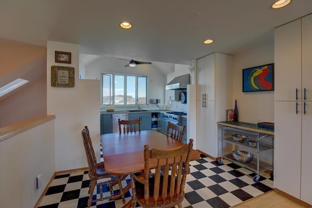 dining area featuring ceiling fan and sink