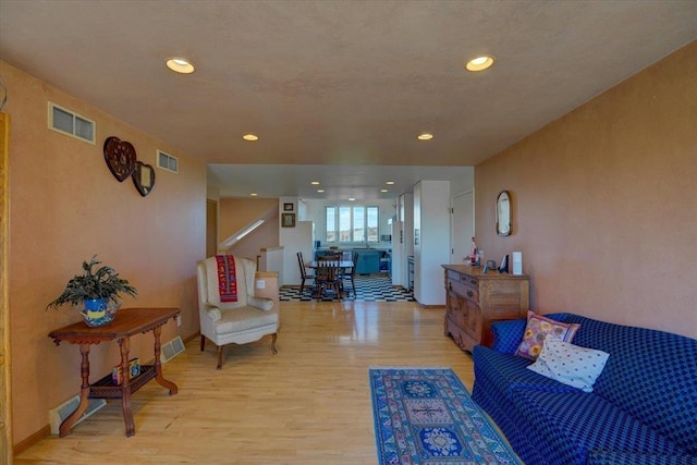 living room with light hardwood / wood-style flooring