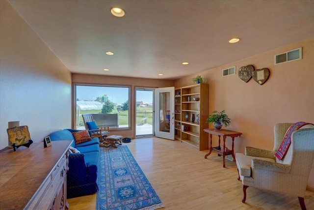 sitting room with light hardwood / wood-style floors