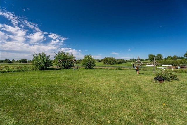 view of yard with a rural view