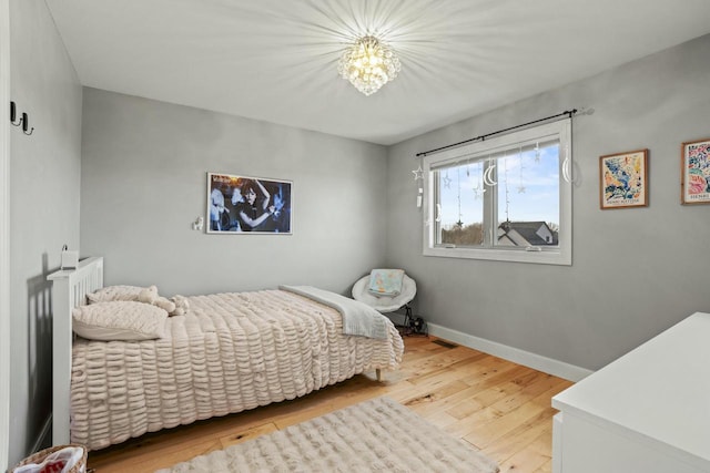 bedroom with light hardwood / wood-style floors