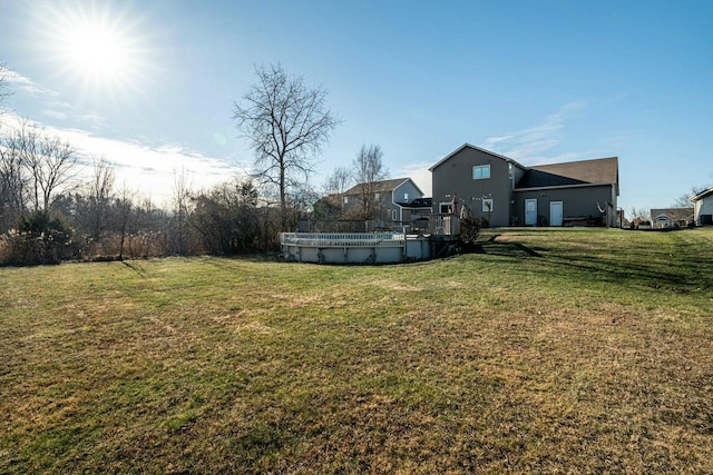 view of yard with a covered pool