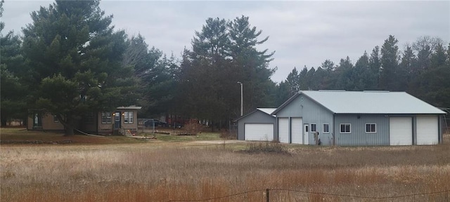 exterior space with an outdoor structure and a garage