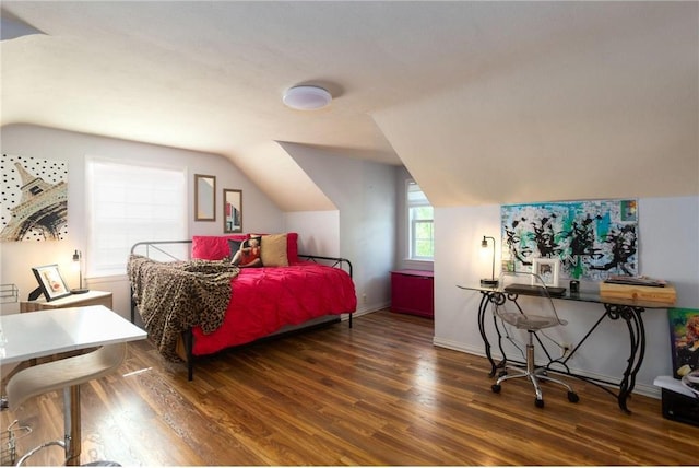 bedroom with dark hardwood / wood-style flooring and vaulted ceiling