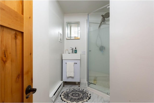 bathroom with baseboard heating, sink, and walk in shower