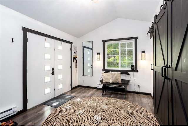 entrance foyer featuring a barn door, dark hardwood / wood-style flooring, lofted ceiling, and baseboard heating