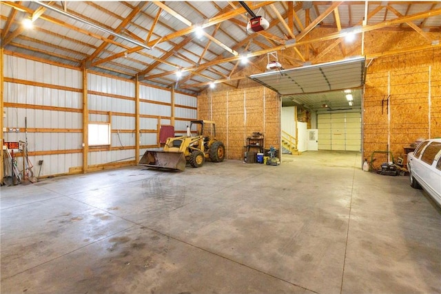 garage with a garage door opener and a carport