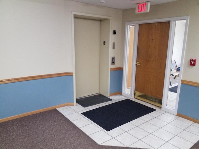 doorway to property featuring elevator