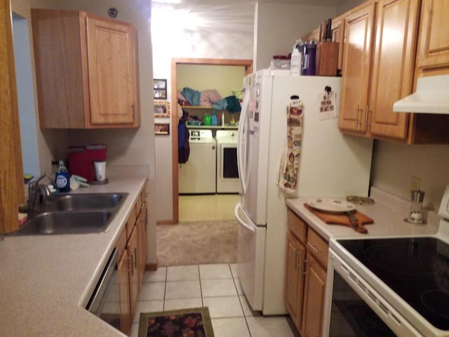 kitchen with washing machine and clothes dryer, sink, stainless steel dishwasher, electric stove, and light tile patterned flooring