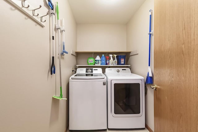 washroom with washer and clothes dryer