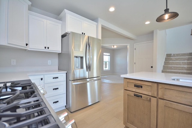 929 5 Mile Rd, Racine, WI 53402 - kitchen featuring stainless steel fridge, light countertops, light wood-style floors, white cabinets, and recessed lighting