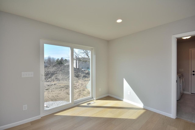 929 5 Mile Rd, Racine, WI 53402 - empty room with washer and dryer, light wood-style floors, and recessed lighting