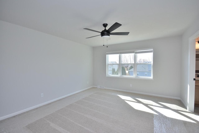 929 5 Mile Rd, Racine, WI 53402 - spare room with light colored carpet and a ceiling fan