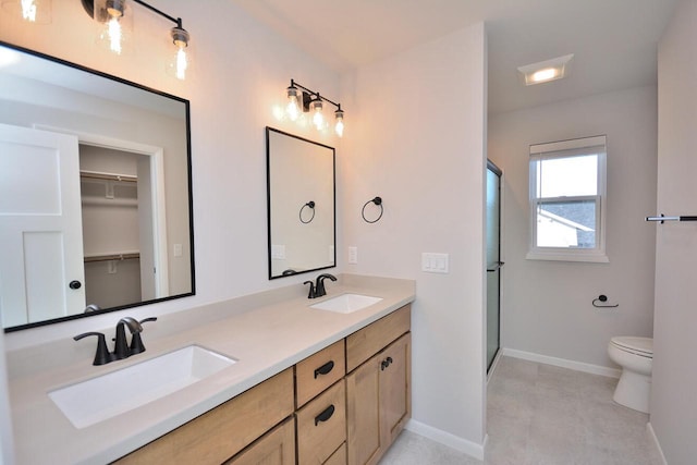 929 5 Mile Rd, Racine, WI 53402 - bathroom featuring double vanity, a shower stall, and a walk in closet