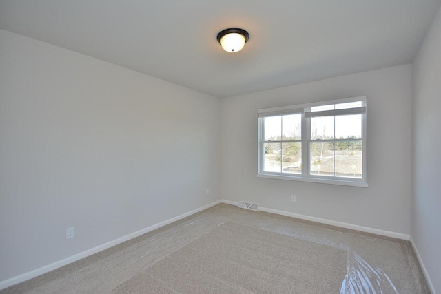 929 5 Mile Rd, Racine, WI 53402 - unfurnished room with baseboards and light colored carpet