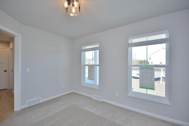 929 5 Mile Rd, Racine, WI 53402 - carpeted spare room with baseboards