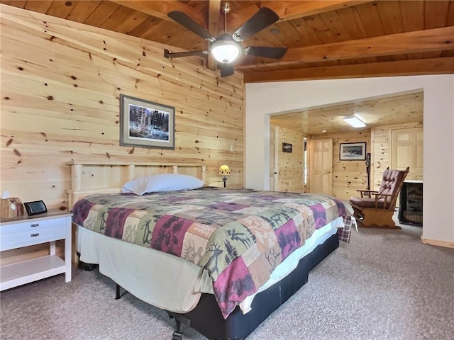 bedroom with vaulted ceiling with beams, carpet floors, and wood ceiling