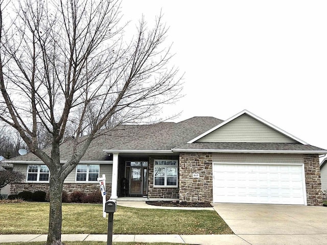 view of front facade with a garage and a front lawn