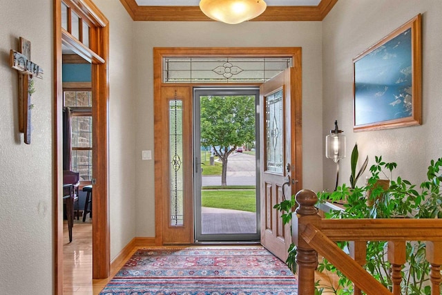 217 Hidden Ridges Way, Combined Locks, WI 54113 - entrance foyer featuring crown molding, wood finished floors, baseboards, and a textured wall