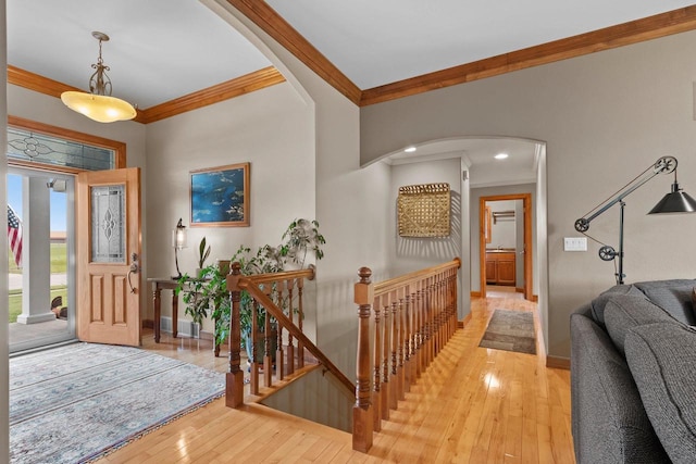 217 Hidden Ridges Way, Combined Locks, WI 54113 - foyer entrance with ornamental molding, arched walkways, baseboards, and light wood-type flooring
