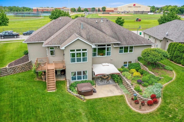 217 Hidden Ridges Way, Combined Locks, WI 54113 - rear view of property featuring a patio area, stairway, a deck, a hot tub, and a gazebo