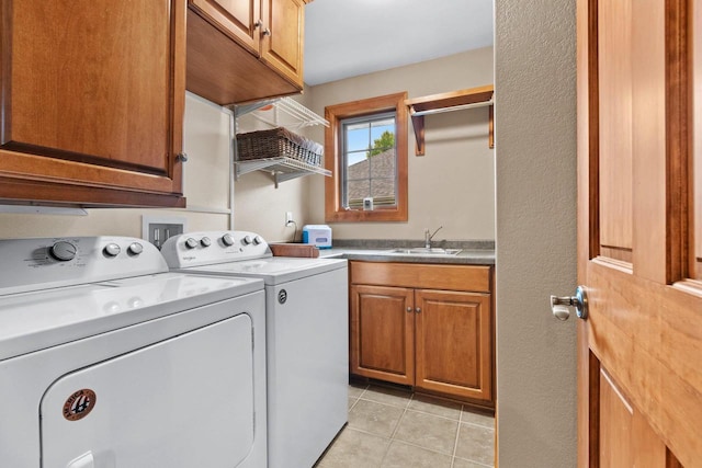 217 Hidden Ridges Way, Combined Locks, WI 54113 - laundry room with independent washer and dryer, cabinet space, and light tile patterned floors