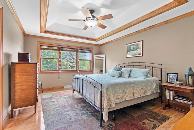 217 Hidden Ridges Way, Combined Locks, WI 54113 - bedroom with a raised ceiling, crown molding, light wood-style flooring, baseboards, and ceiling fan