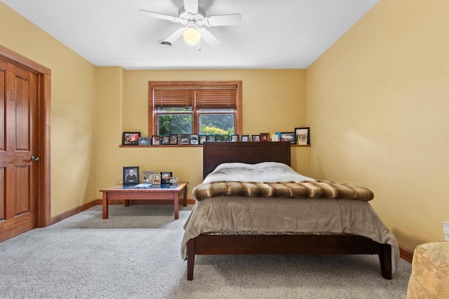 bedroom featuring ceiling fan and light carpet