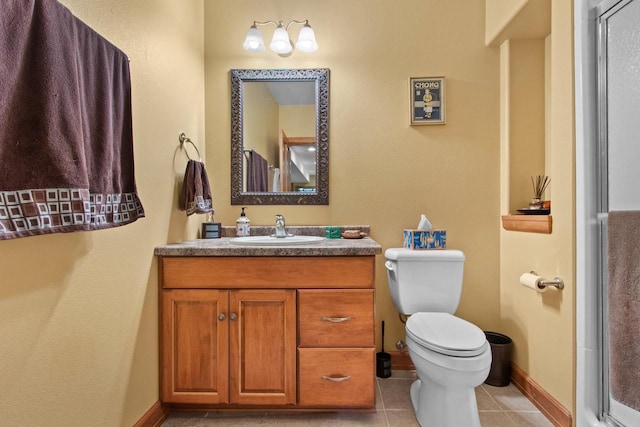 217 Hidden Ridges Way, Combined Locks, WI 54113 - bathroom with toilet, vanity, tile patterned flooring, and baseboards