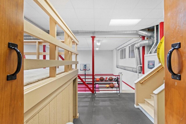 217 Hidden Ridges Way, Combined Locks, WI 54113 - finished basement featuring stairway, a drop ceiling, and baseboards