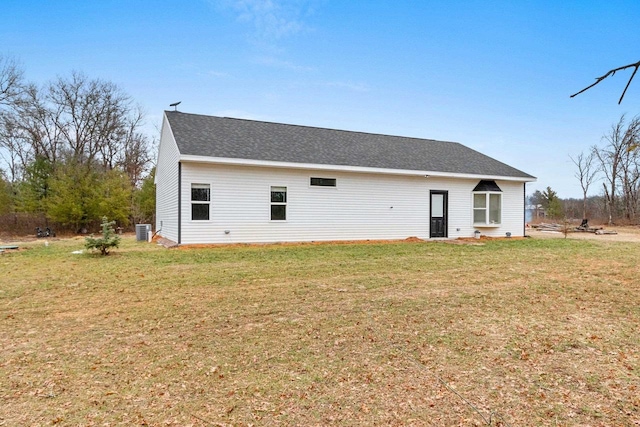 back of property featuring a yard and cooling unit