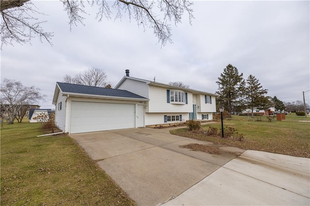 view of front of house featuring a garage and a front lawn