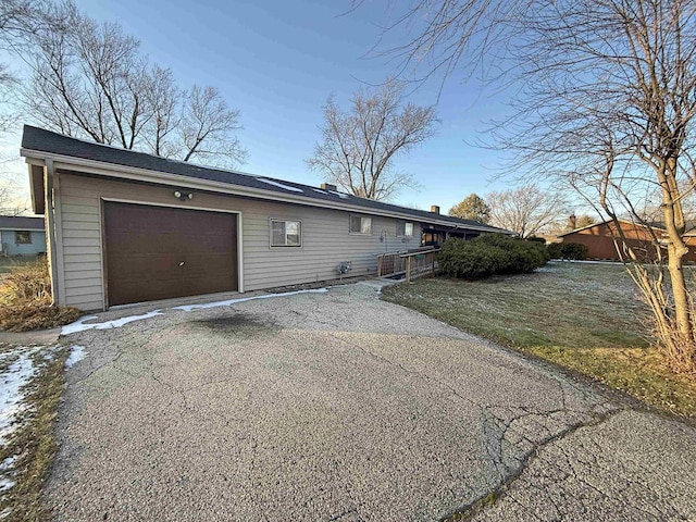 637 N Wright Rd, Janesville, WI 53546 - view of side of property with an attached garage and driveway