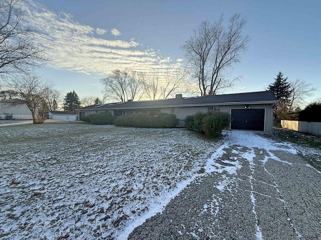 637 N Wright Rd, Janesville, WI 53546 - view of front facade featuring an attached garage and driveway