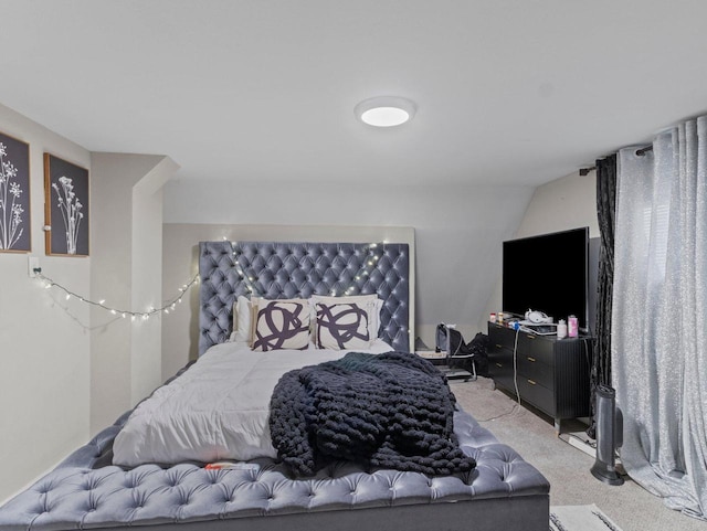 bedroom featuring light colored carpet