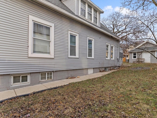 view of home's exterior featuring a yard